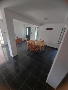 a dining room with a table and chairs at Casa en Pueblo Esther in Esther