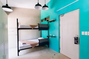 Postel nebo postele na pokoji v ubytování Spin Designer Hostel - El Nido