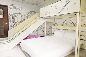 Una cama o camas en una habitación de 宜家莊親子民宿