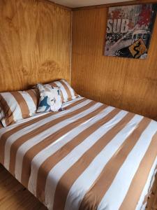 a large bed in a room with at Ruta Austral - Coyhaique in Coihaique
