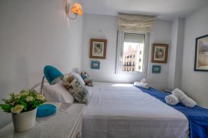 Postel nebo postele na pokoji v ubytování The Rose by Hello Homes Sitges