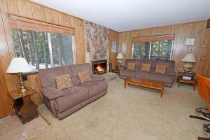 a living room with a couch and a fireplace at 1629 Pioneer Trail home in South Lake Tahoe