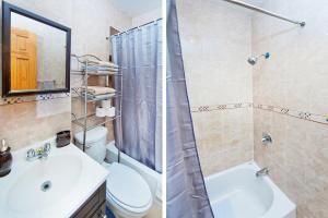 a bathroom with a sink and a toilet and a shower at 102-2A Specious 2BR Best Value Near Cntrl Park in New York