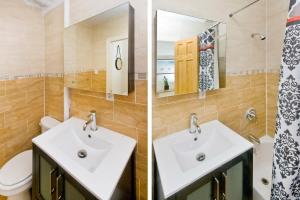 a bathroom with a sink and a toilet and a mirror at 102-1A Best Value 2BR Apt Near Central Park in New York