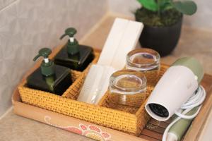 a wicker tray with some complimentary items on a table at Mere Sea View Penida in Nusa Penida