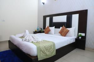 Hotel Global Inn By Quality Inn房間的床