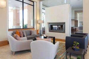 a living room with a couch and a fireplace at Paradise Palms By Mid Florida Home Management in Orlando