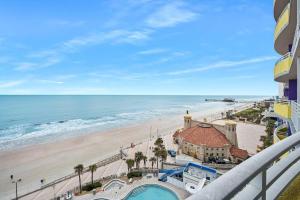 a view of the beach from the balcony of a condo at Luxury 10th Floor 1 BR Condo Direct Oceanfront Wyndham Ocean Walk Resort Daytona Beach | 1006 in Daytona Beach