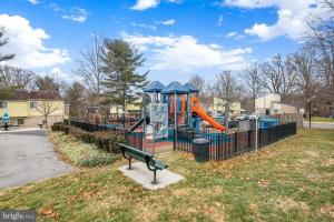 a playground with a slide in a park at Entire Home in North Potomac in Potomac