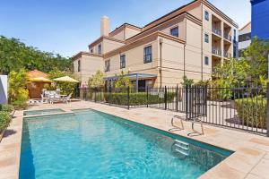 a swimming pool in front of a house at Northbridge Prime Location*2BR in Perth