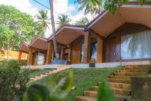 a building with stairs in front of it at GRAND OCEANUS RESORT in Beadonābād +27 photos
