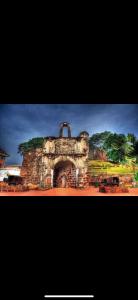 an old stone building with trees on top of it at LuxuryFamilySuite6-9Pax-JonkerStreet-CityTown in Melaka