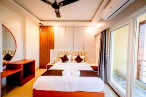 Goroomgo Shree Gajanana Puri Near Sea Beach - Lift Facilities - Best Sellingにあるベッド