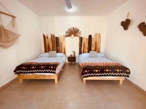 Postel nebo postele na pokoji v ubytování Villa Azul Xulha