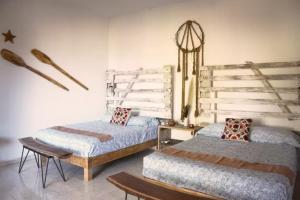 Postel nebo postele na pokoji v ubytování Villa Azul Xulha