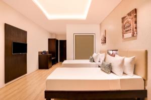 Keys Select by Lemon Tree Hotels, Udaipur客房内的一张或多张床位