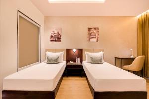 Keys Select by Lemon Tree Hotels, Udaipur客房内的一张或多张床位