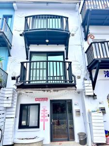 a building with balconies on the side of it at Nanwan254 Homestay in Nanwan