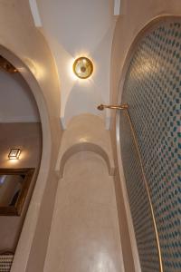 a hallway with a spiral staircase in a building at Riad Amalia in Marrakech