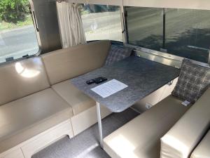 a small table in the back of a bus at Nature Resort in Shimanto in Funato