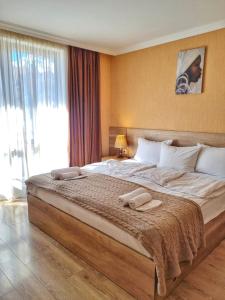 Postelja oz. postelje v sobi nastanitve Sunshine Kazbegi