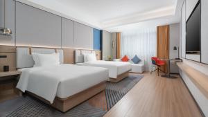 Postel nebo postele na pokoji v ubytování Holiday Inn Express Quanzhou Taishang, an IHG Hotel