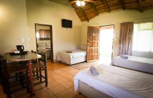 Ένα ή περισσότερα κρεβάτια σε δωμάτιο στο Northgate Lodge