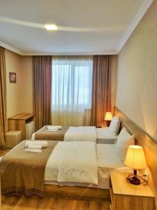Postelja oz. postelje v sobi nastanitve Sunshine Kazbegi