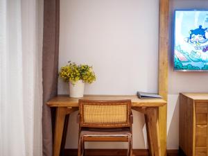 Uma televisão e/ou sistema de entretenimento em Wang Yun Residence Boutique Homestay Zhangjiajie