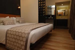 Postel nebo postele na pokoji v ubytování HOTEL SR