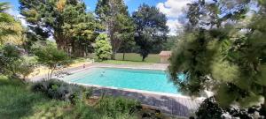 a swimming pool in a yard with trees at Domaine de Calabel in Pouylebon +15 photos