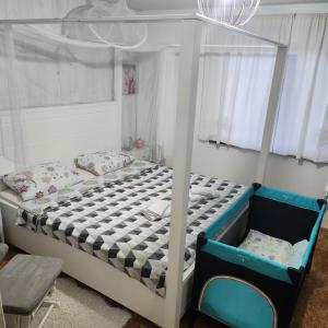 Postel nebo postele na pokoji v ubytování Kuća za odmor Kleopatra