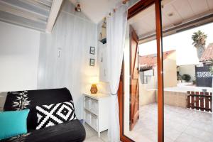 Televiisor ja/või meelelahutuskeskus majutusasutuses Petit coin de paradis à Port-Leucate