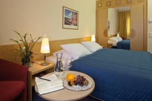 Postel nebo postele na pokoji v ubytování Austria Trend Hotel Europa Salzburg
