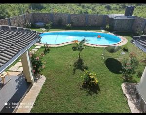 a backyard with a swimming pool in the yard at Lisa Mari in Mombasa