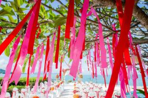 a bunch of pink streamers hanging from a tree at Racha Kiri Resort & Spa, Khanom in Khanom +57 photos