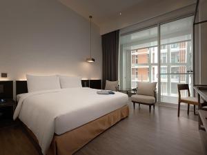 Katil atau katil-katil dalam bilik di Orient Luxury Hotel-Jiaoxi