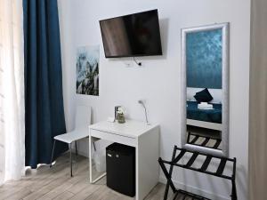 TV a/nebo společenská místnost v ubytování Relais Villa Borghese
