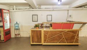 a room with a wooden counter in a room at Hello Hotel in Ho Chi Minh City