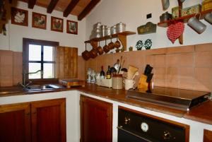 a kitchen with a sink and a counter top at Podere Le Murella in Palaia