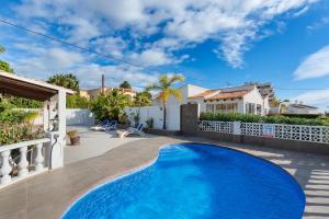 a swimming pool in the backyard of a house at Villa Baobab - Plusholidays in Ifach