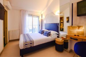 A bed or beds in a room at UNAHOTELS Imperial Sport Hotel