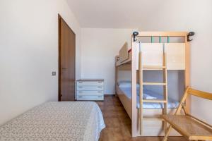 a bedroom with a bunk bed and a ladder at Vacanze Elma in Bussolengo