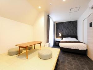 Postel nebo postele na pokoji v ubytování CHA-AN HOTEL UENO