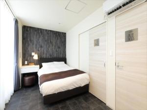 Postel nebo postele na pokoji v ubytování CHA-AN HOTEL UENO