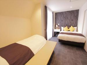 Postel nebo postele na pokoji v ubytování CHA-AN HOTEL UENO