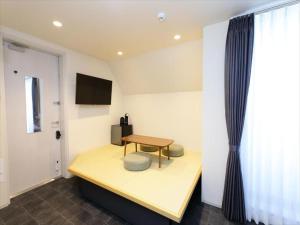 TV a/nebo společenská místnost v ubytování CHA-AN HOTEL UENO