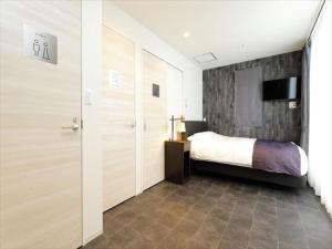 Postel nebo postele na pokoji v ubytování CHA-AN HOTEL UENO