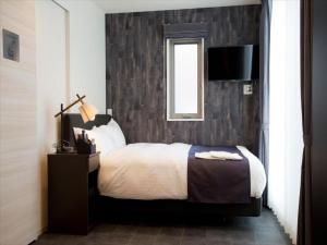 Postel nebo postele na pokoji v ubytování CHA-AN HOTEL UENO