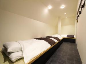 Postel nebo postele na pokoji v ubytování CHA-AN HOTEL UENO